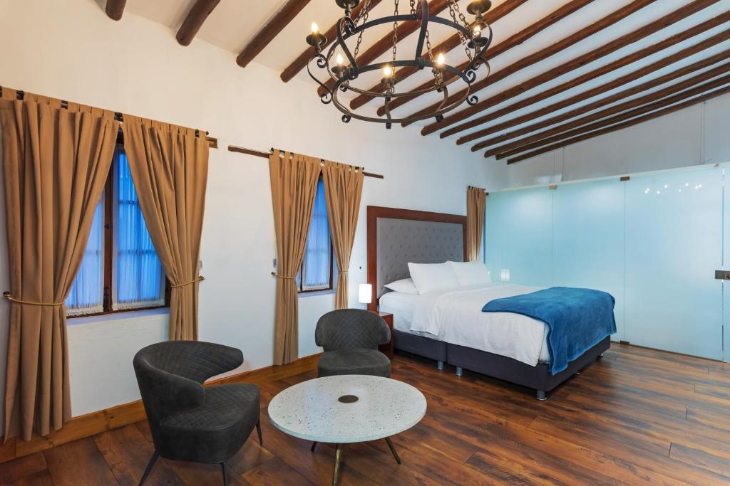 Postel nebo postele na pokoji v ubytování Hotel Boutique MR