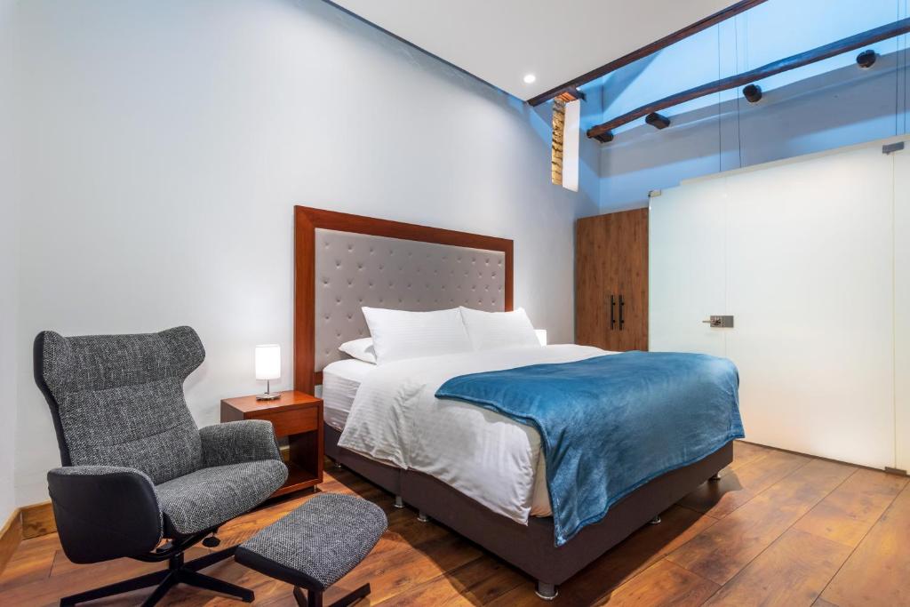Postel nebo postele na pokoji v ubytování Hotel Boutique MR