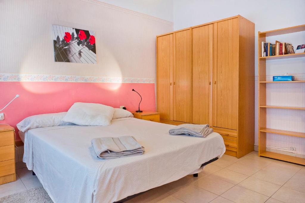 Postel nebo postele na pokoji v ubytování Verdaguer Home