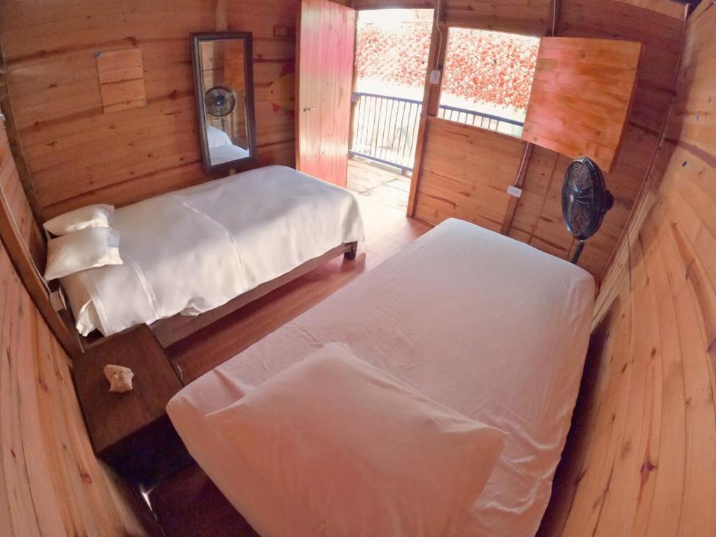 Postel nebo postele na pokoji v ubytování Eco hotel Mar De Ensueño