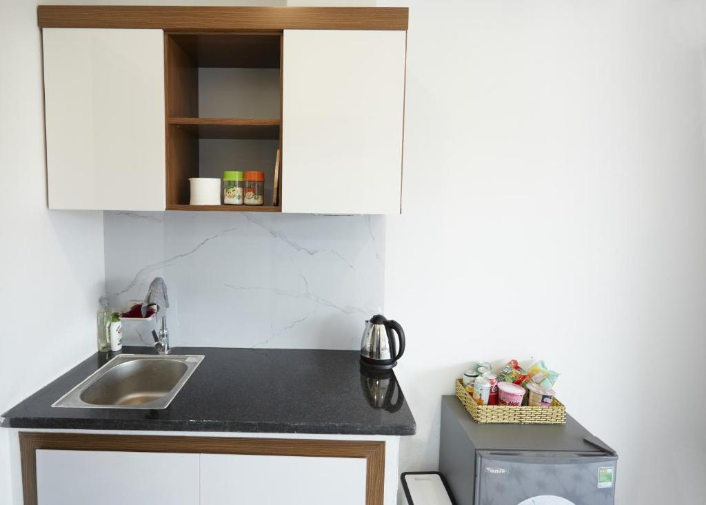 Kuchyň nebo kuchyňský kout v ubytování Sweet Apartment Sa Pa