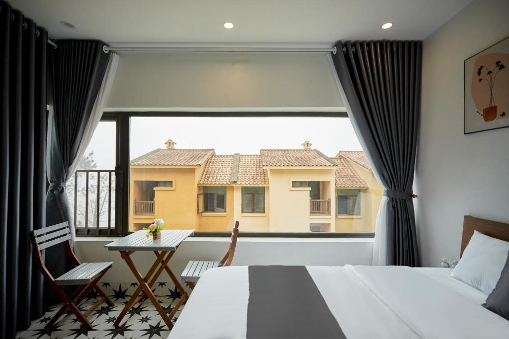 Postel nebo postele na pokoji v ubytování Sweet Apartment Sa Pa