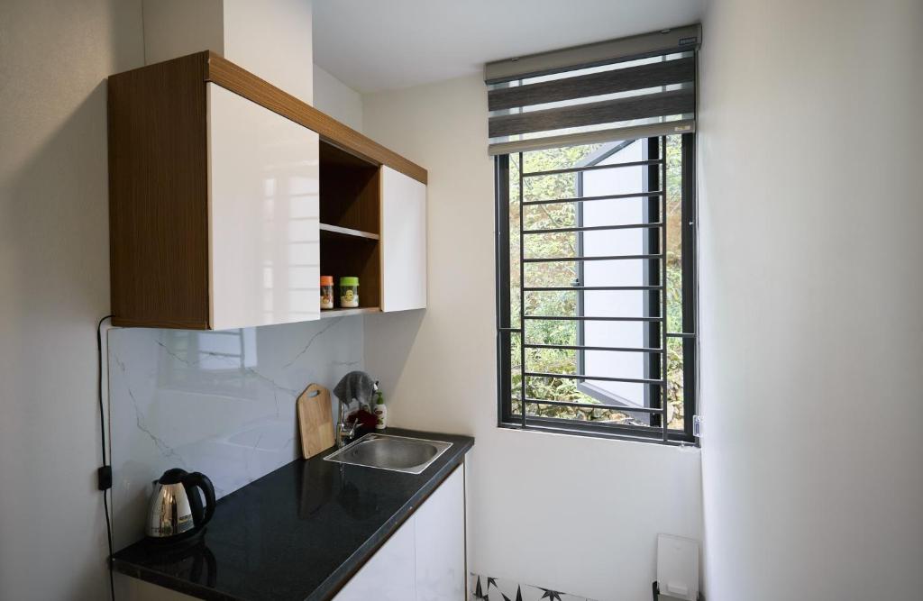 Kuchyň nebo kuchyňský kout v ubytování Sweet Apartment Sa Pa