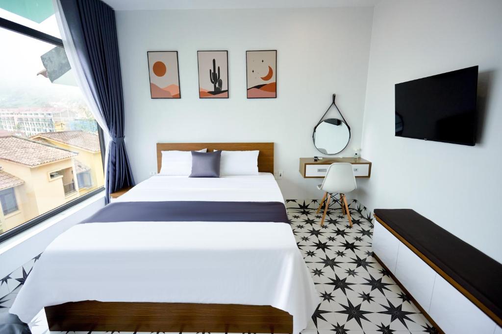 Postel nebo postele na pokoji v ubytování Sweet Apartment Sa Pa