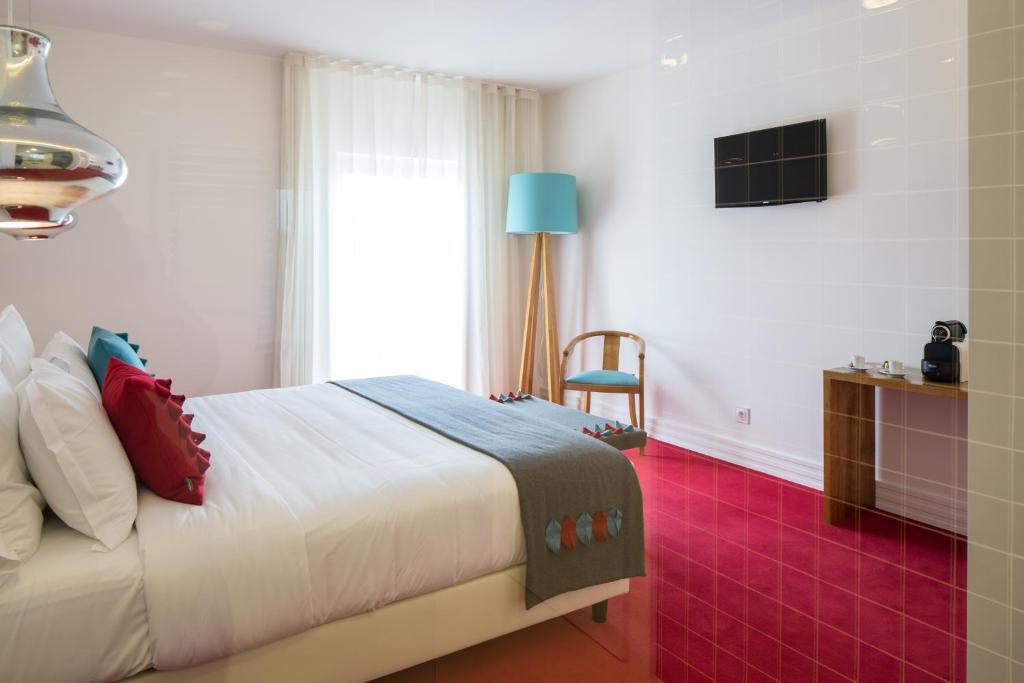 Uma cama ou camas num quarto em Cerca Design House