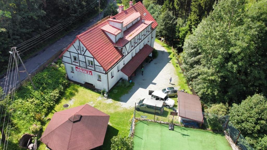 an overhead view of a large house with a red roof at Pensjonat Sokolec in Sokolec