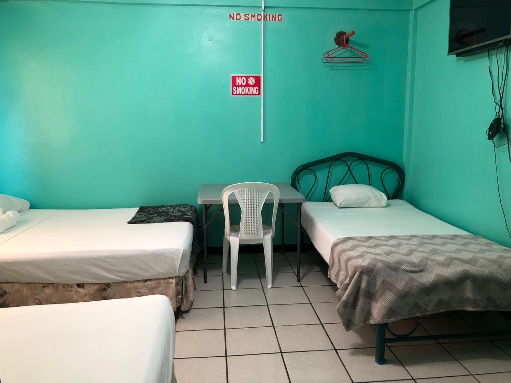 Postel nebo postele na pokoji v ubytování Chaleanor Hotel