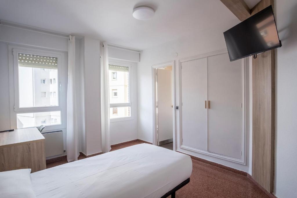 Postel nebo postele na pokoji v ubytování Residencia Zeta Home