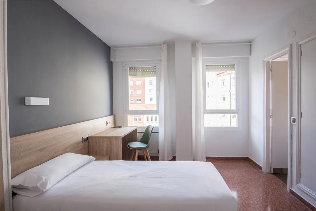 Postel nebo postele na pokoji v ubytování Residencia Zeta Home