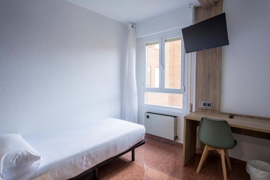 Postel nebo postele na pokoji v ubytování Residencia Zeta Home