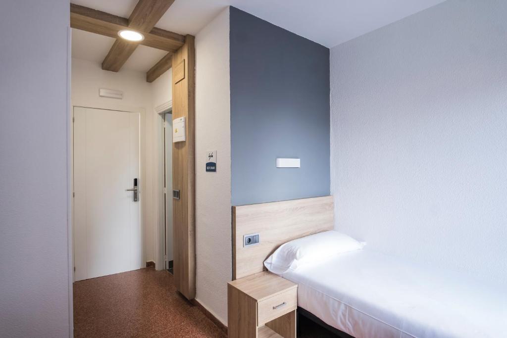 Postel nebo postele na pokoji v ubytování Residencia Zeta Home