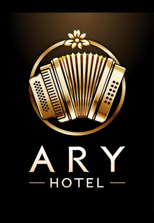 a hotel logo with an accordion on a black background at ARY Hotel in Valledupar