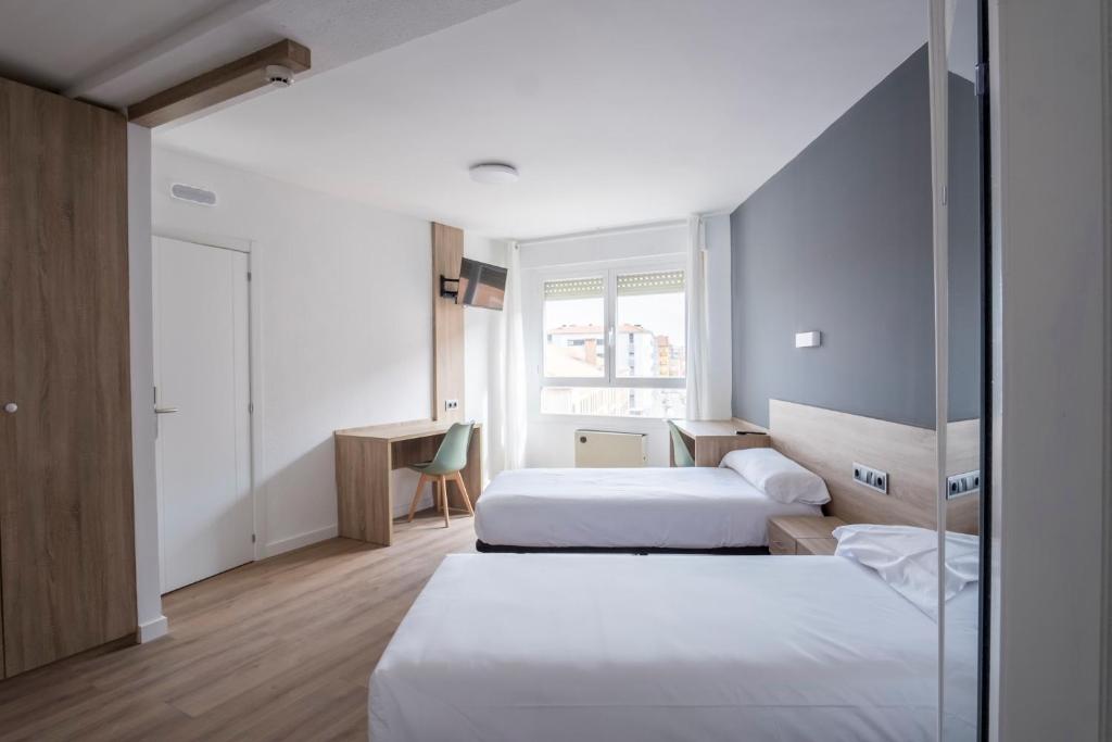 Postel nebo postele na pokoji v ubytování Residencia Zeta Home