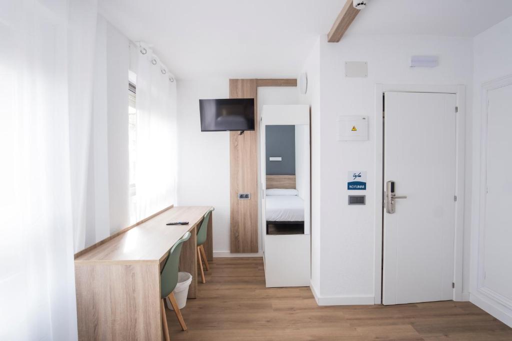 TV a/nebo společenská místnost v ubytování Residencia Zeta Home