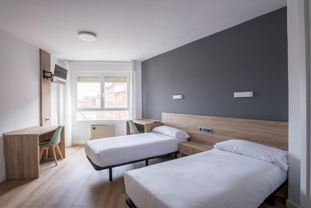 Postel nebo postele na pokoji v ubytování Residencia Zeta Home