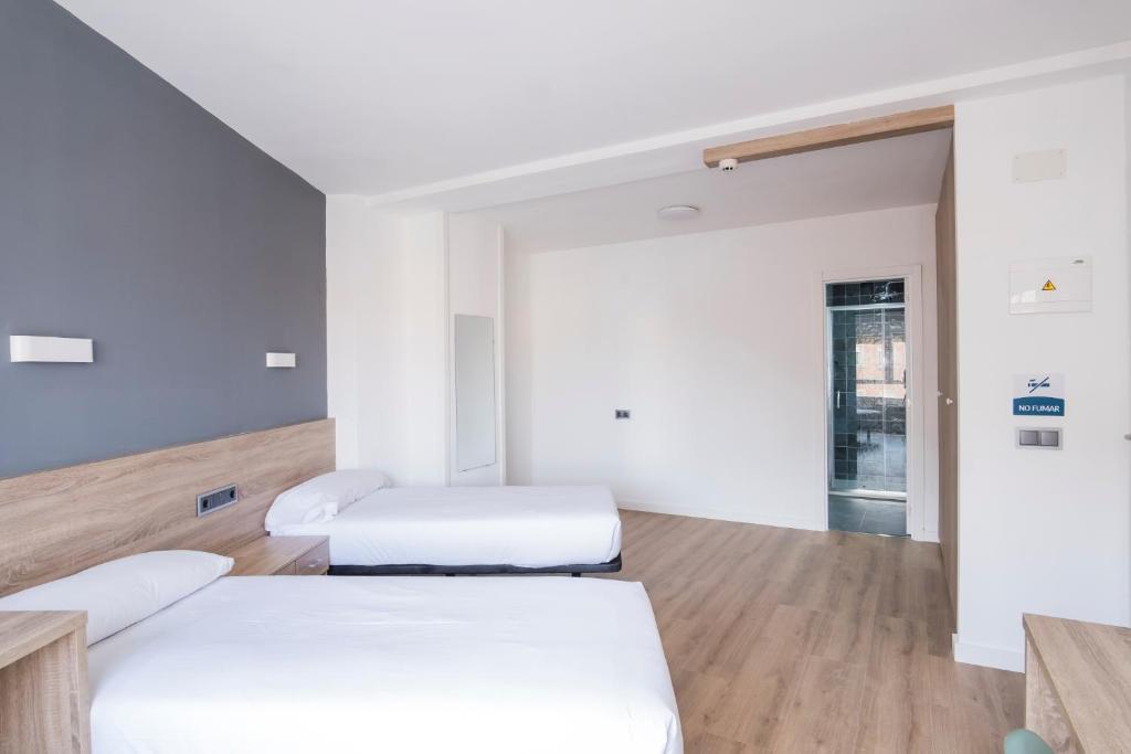 Postel nebo postele na pokoji v ubytování Residencia Zeta Home