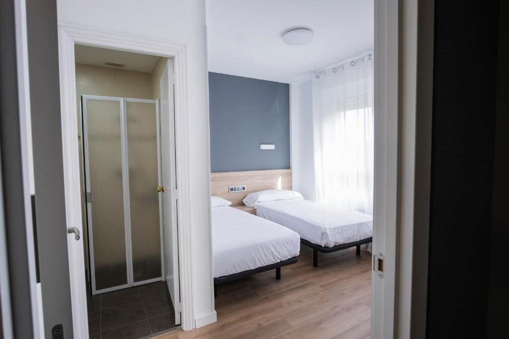 Postel nebo postele na pokoji v ubytování Residencia Zeta Home