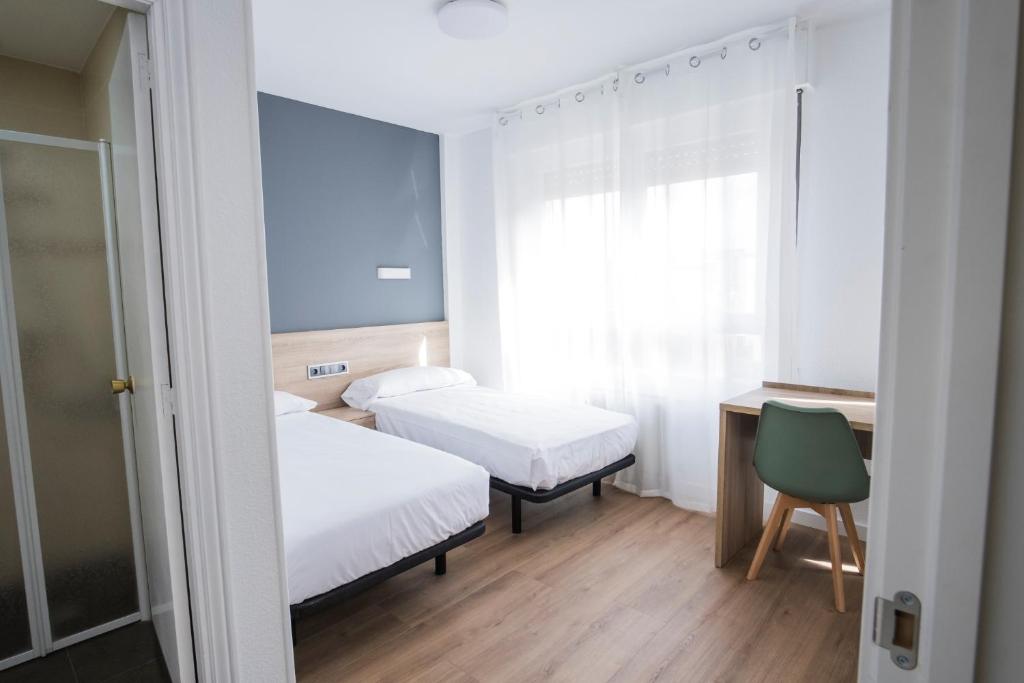 Postel nebo postele na pokoji v ubytování Residencia Zeta Home