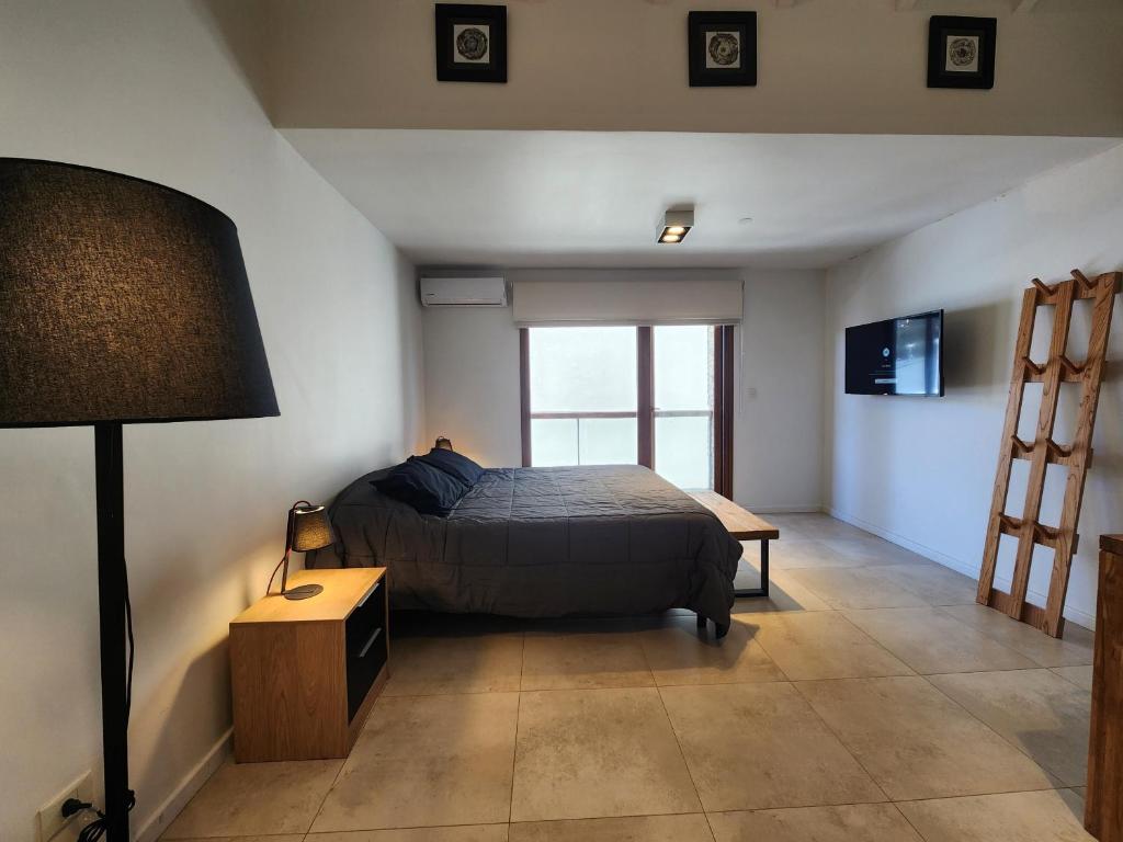 Ένα ή περισσότερα κρεβάτια σε δωμάτιο στο Alamos de los Andes Studios - Andarlibre