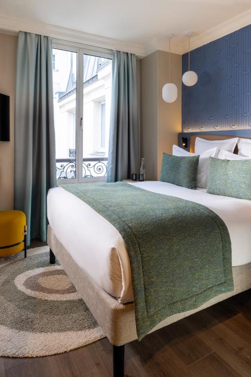 Postel nebo postele na pokoji v ubytování Hôtel L'Ormaie & Spa