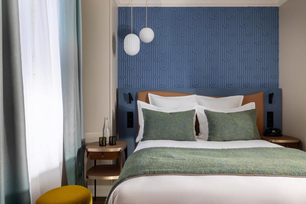 Postel nebo postele na pokoji v ubytování Hôtel L'Ormaie & Spa