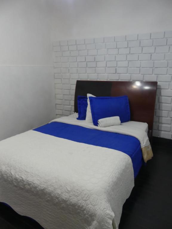 Postel nebo postele na pokoji v ubytování Hostal Hanoi en Bogotá