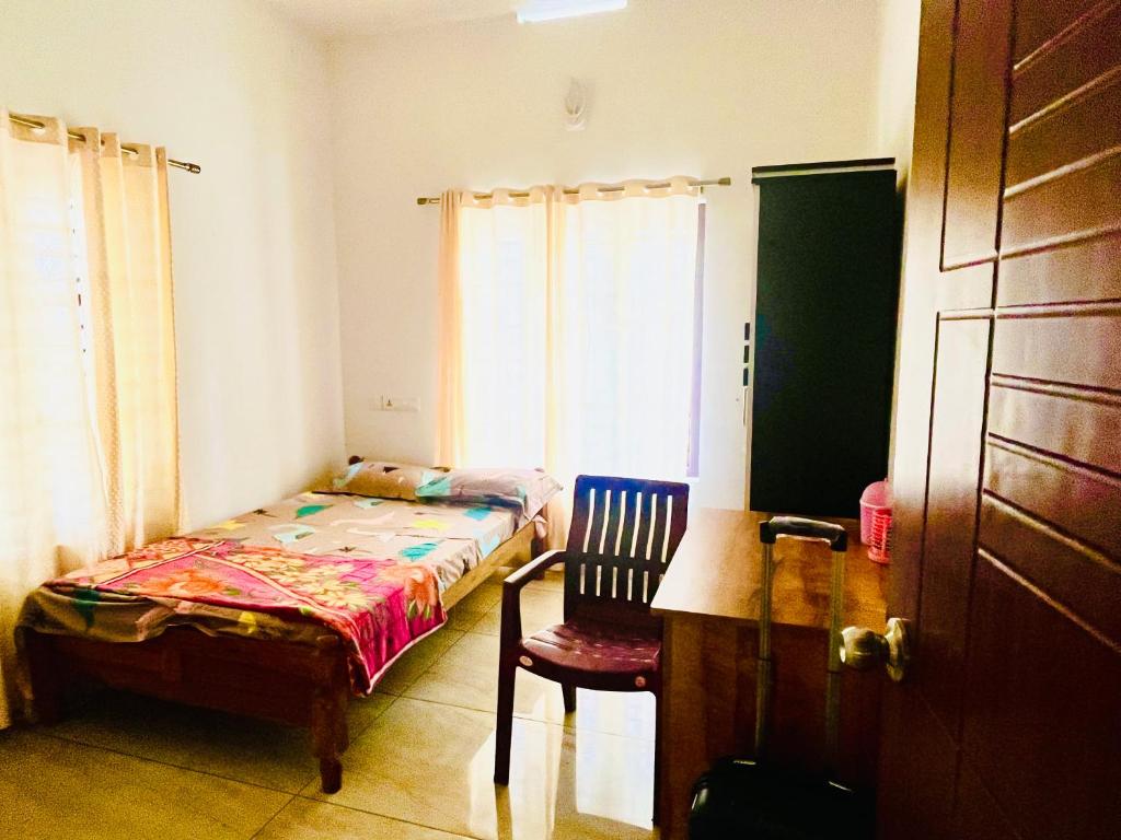 Postel nebo postele na pokoji v ubytování Nilaavu Homes - The Staycation at Wayanad