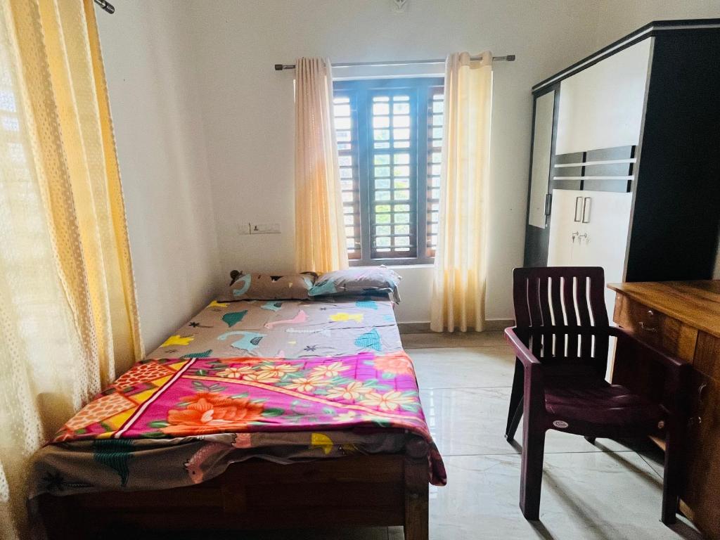 Postel nebo postele na pokoji v ubytování Nilaavu Homes - The Staycation at Wayanad
