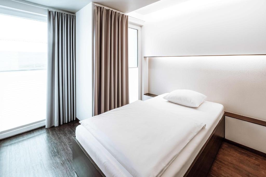 Postel nebo postele na pokoji v ubytování Hotel Q! Berlin