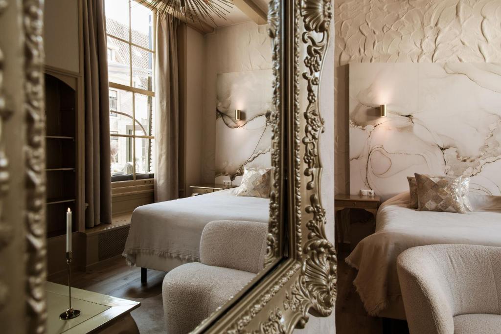 Postel nebo postele na pokoji v ubytování Boutique Hotel Elburg met Tapperij