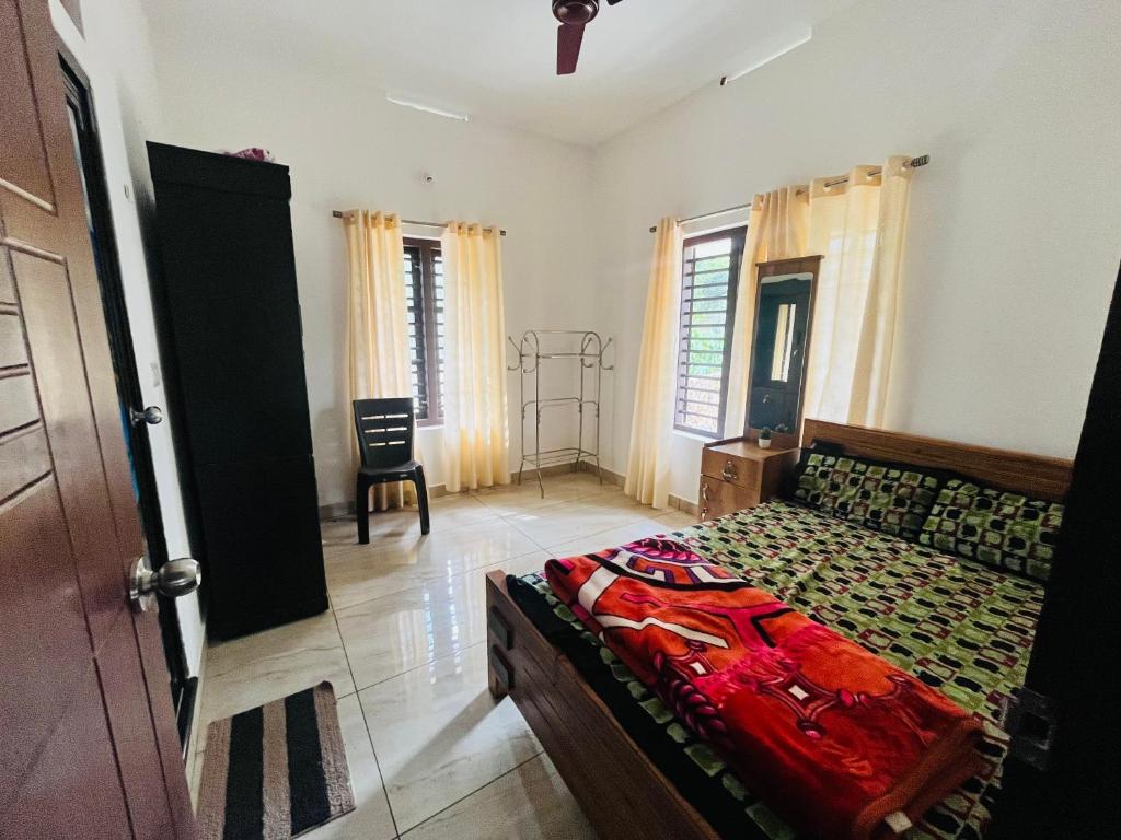 Postel nebo postele na pokoji v ubytování Nilaavu Homes - The Staycation at Wayanad