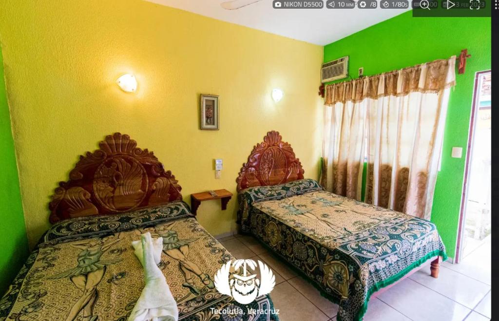 Postel nebo postele na pokoji v ubytování Hotel Villas de Plan