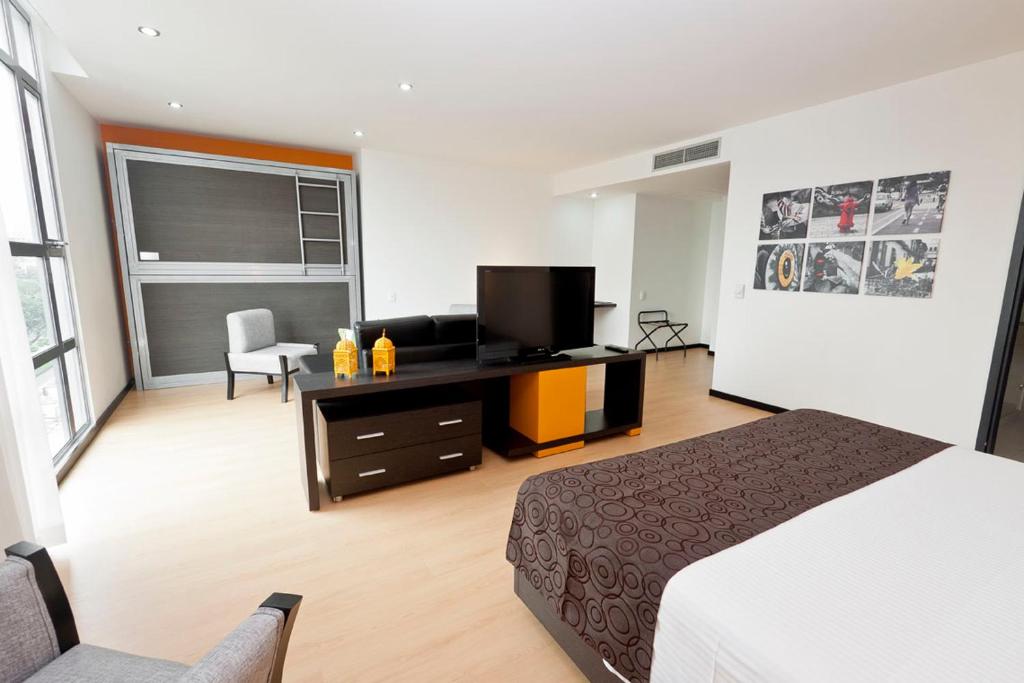 Postel nebo postele na pokoji v ubytování Tequendama Hotel Medellín - Estadio