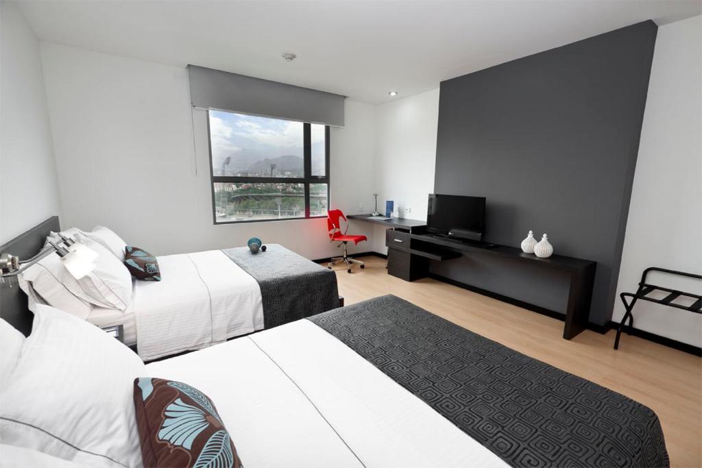 Postel nebo postele na pokoji v ubytování Tequendama Hotel Medellín - Estadio