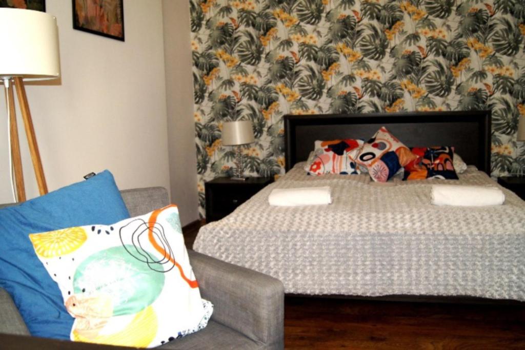 Posteľ alebo postele v izbe v ubytovaní Cozy Old Town Apartments