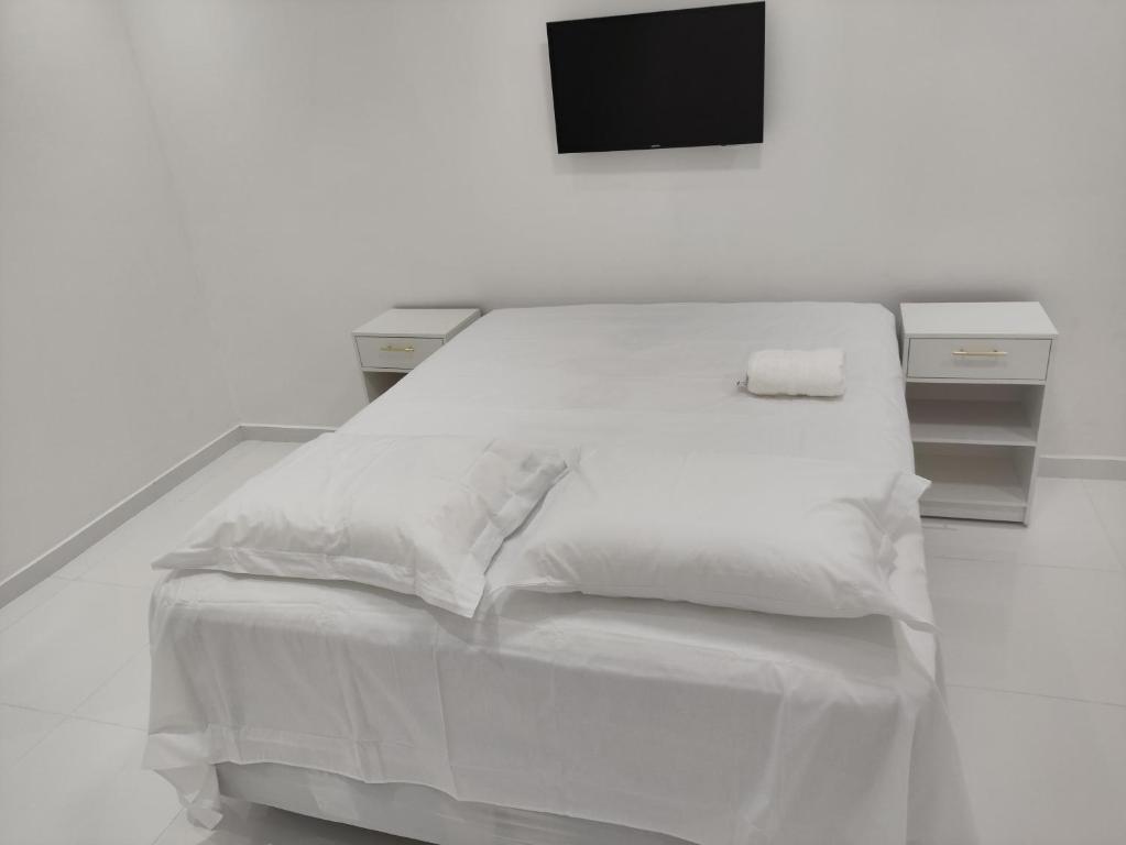 Postel nebo postele na pokoji v ubytování Pousada CHOW
