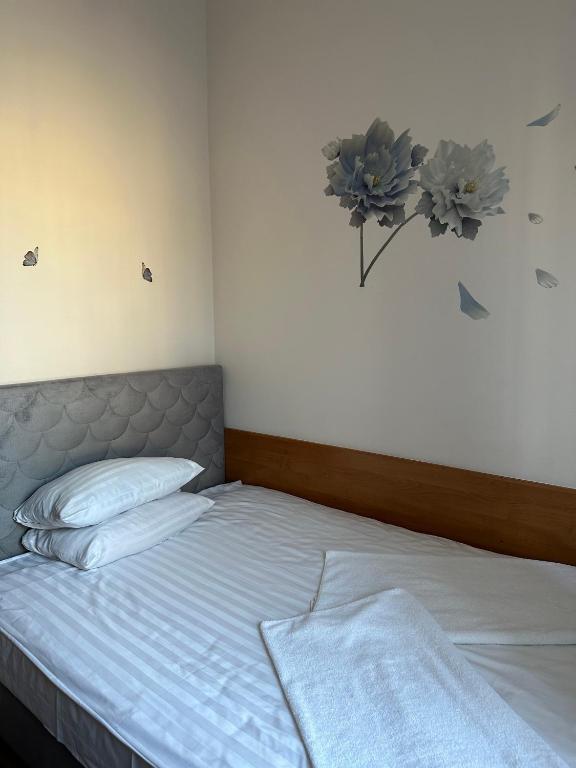 Postel nebo postele na pokoji v ubytování Hotel Haga