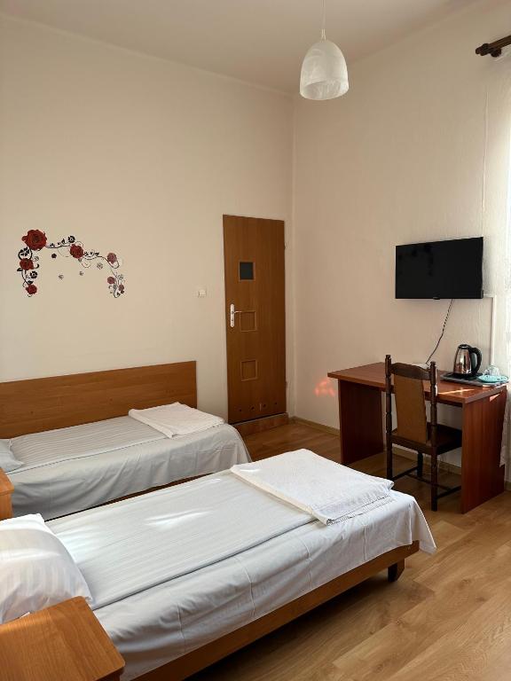 Postel nebo postele na pokoji v ubytování Hotel Haga