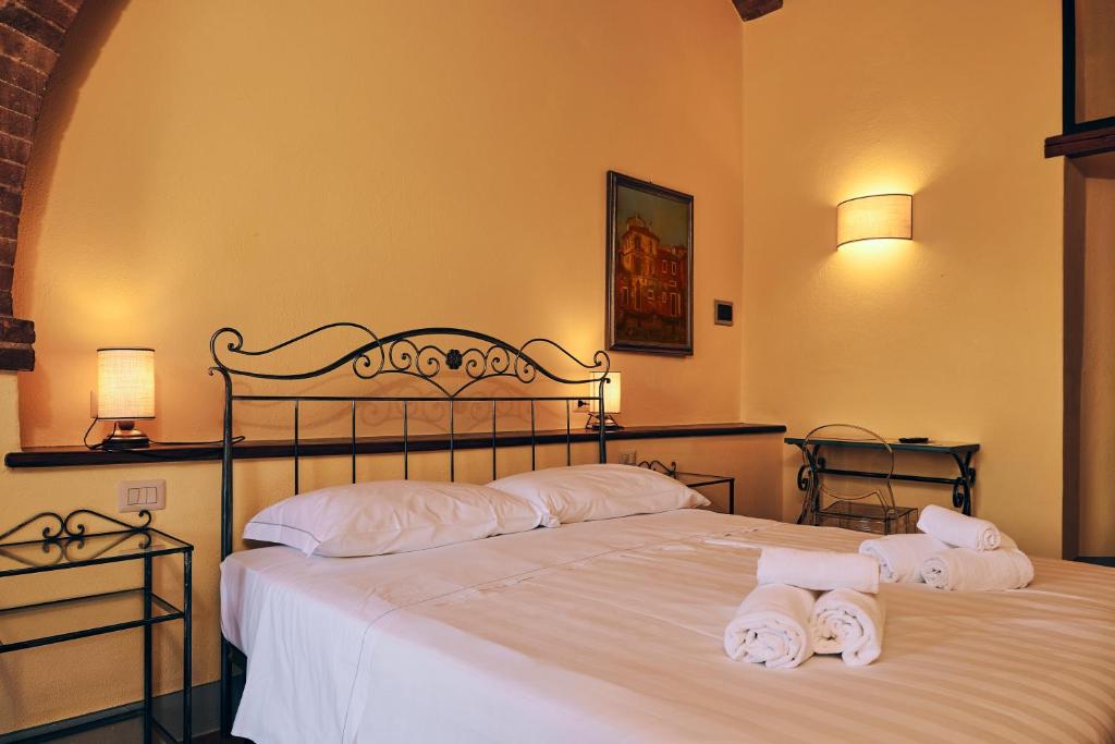 Postel nebo postele na pokoji v ubytování Agriturismo San Sano