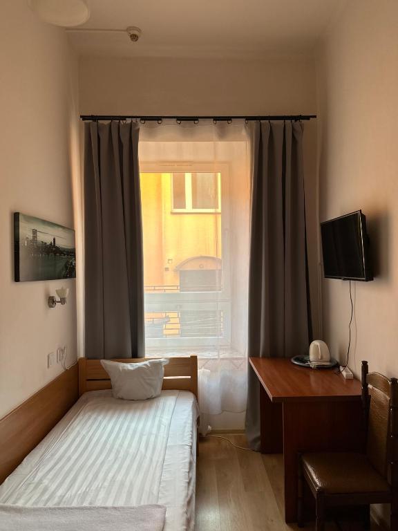 Postel nebo postele na pokoji v ubytování Hotel Haga