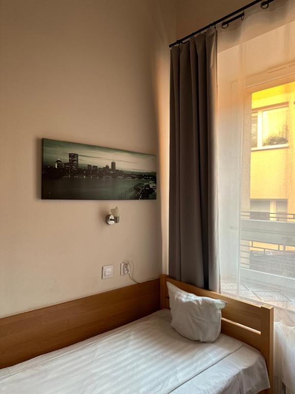 Postel nebo postele na pokoji v ubytování Hotel Haga