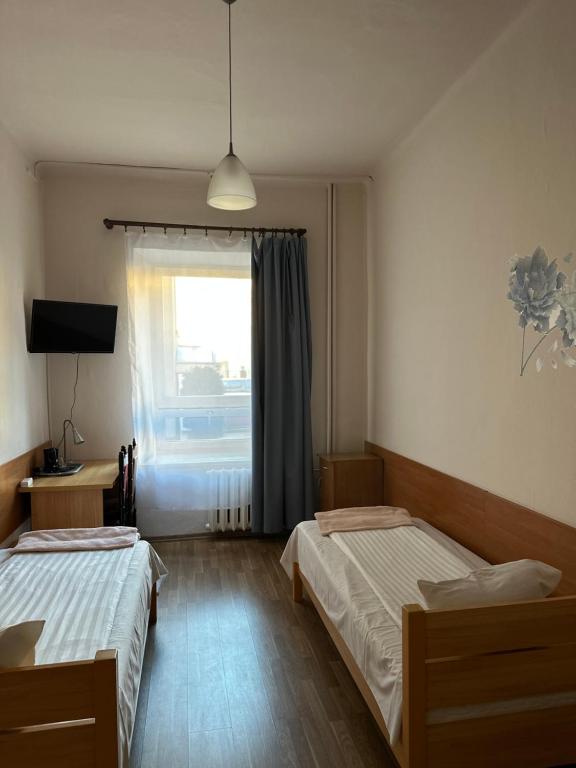 Postel nebo postele na pokoji v ubytování Hotel Haga