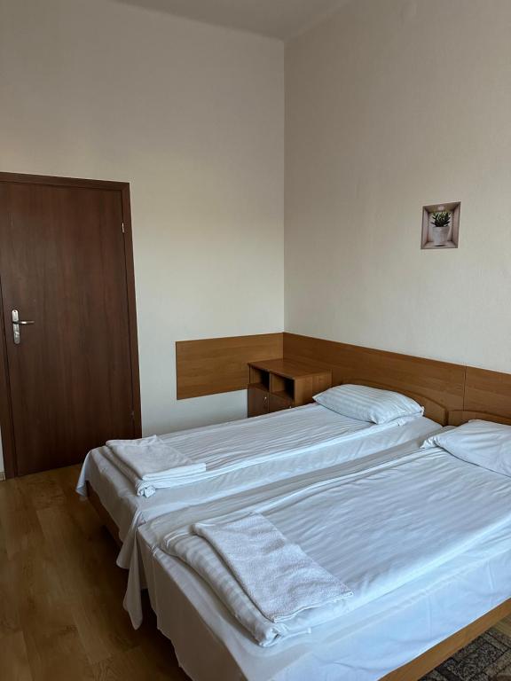Postel nebo postele na pokoji v ubytování Hotel Haga