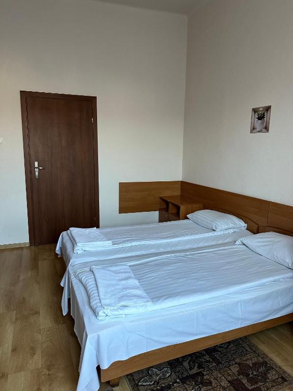 Postel nebo postele na pokoji v ubytování Hotel Haga