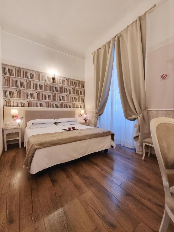 Postel nebo postele na pokoji v ubytování Hotel Charly