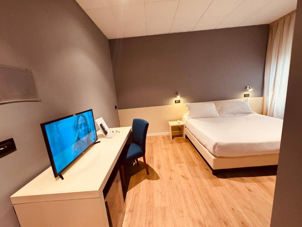 Postel nebo postele na pokoji v ubytování Hotel Pex Mantova