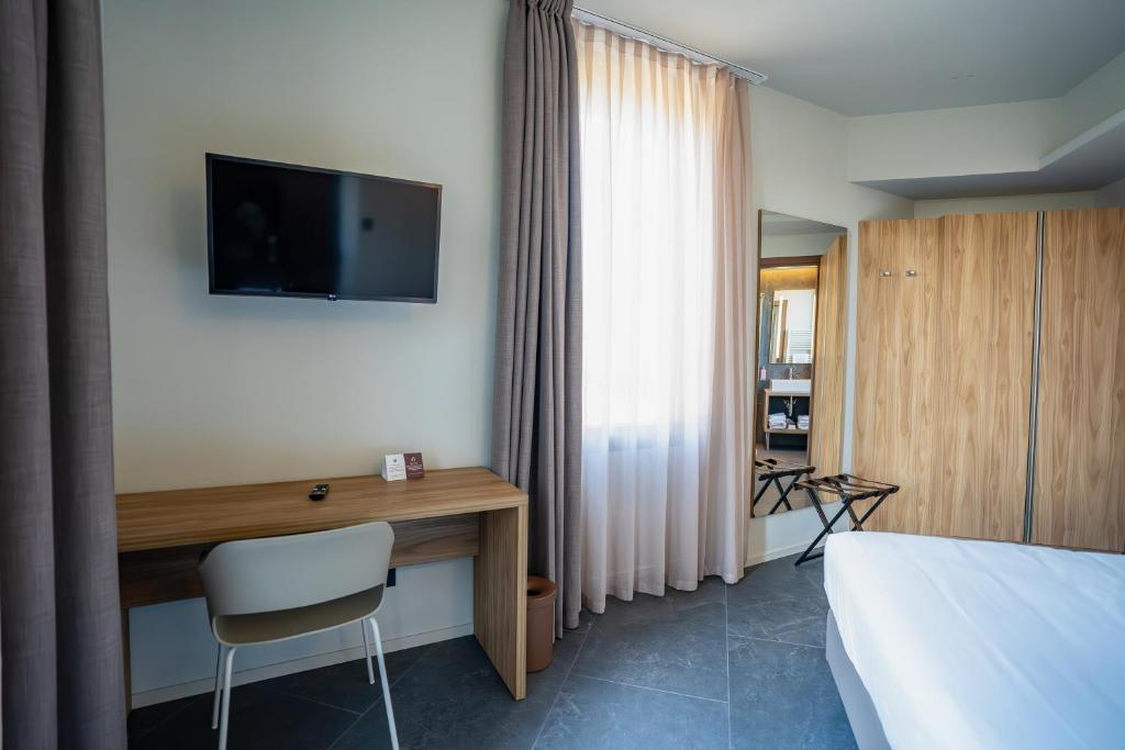 TV a/nebo společenská místnost v ubytování La Molgora Hotel