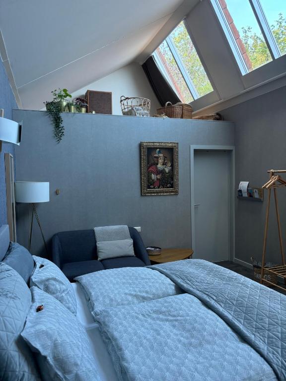 Postel nebo postele na pokoji v ubytování Guesthouse de Loft