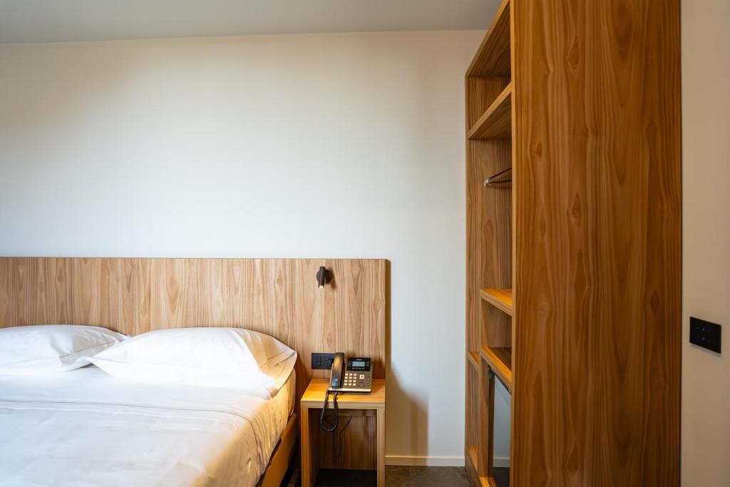 Postel nebo postele na pokoji v ubytování La Molgora Hotel