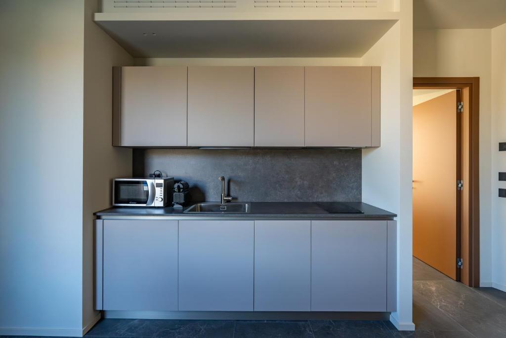 Kuchyň nebo kuchyňský kout v ubytování La Molgora Hotel
